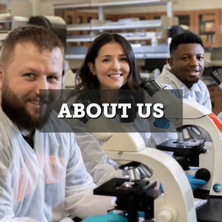 A group of students in white coats using microscopes. Text: about us